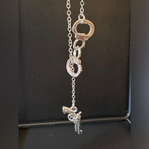 Handcuffs and Pistol Drop Necklace Silvertone